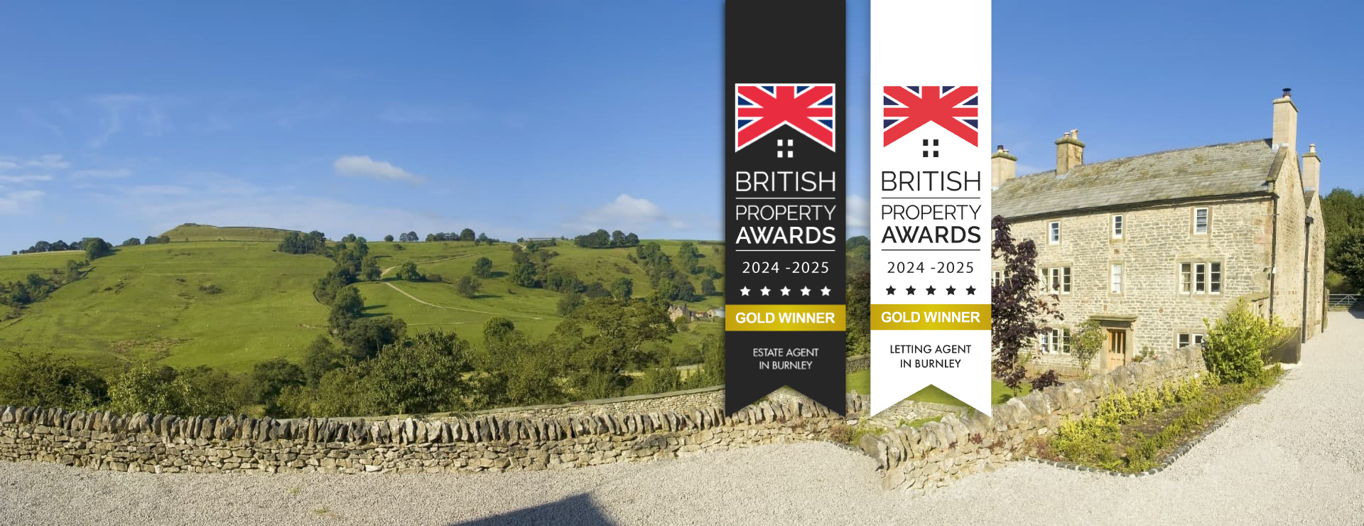 Petty Real awards display in front of a stone Lancashire cottage